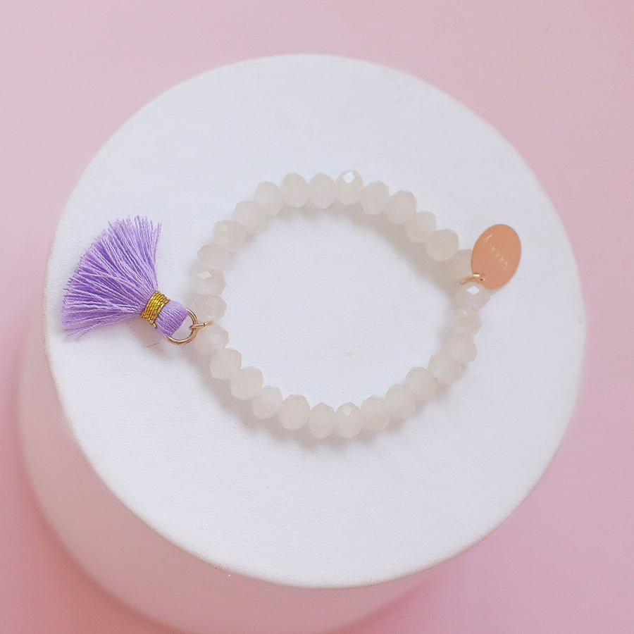 #33 Sample Kids beige beaded bracelet with pink or purple tassel