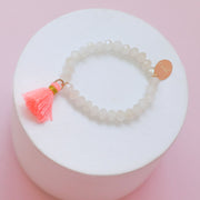 #33 Sample Kids beige beaded bracelet with pink or purple tassel