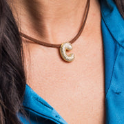 taudrey initial instinct necklace brown cord