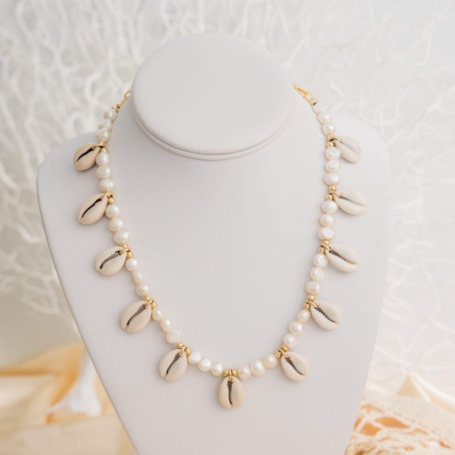 taudrey palm and pearl necklace