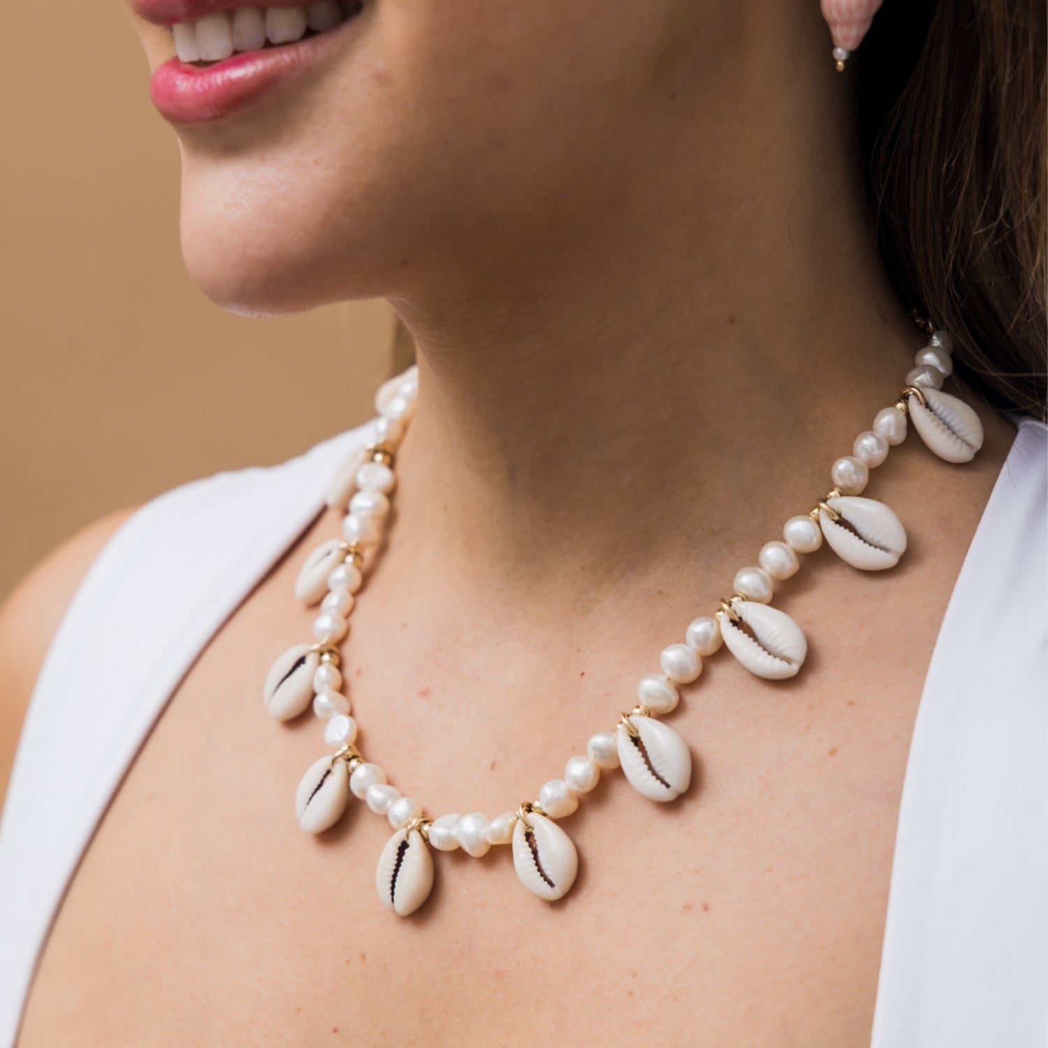 taudrey palm and pearl necklace