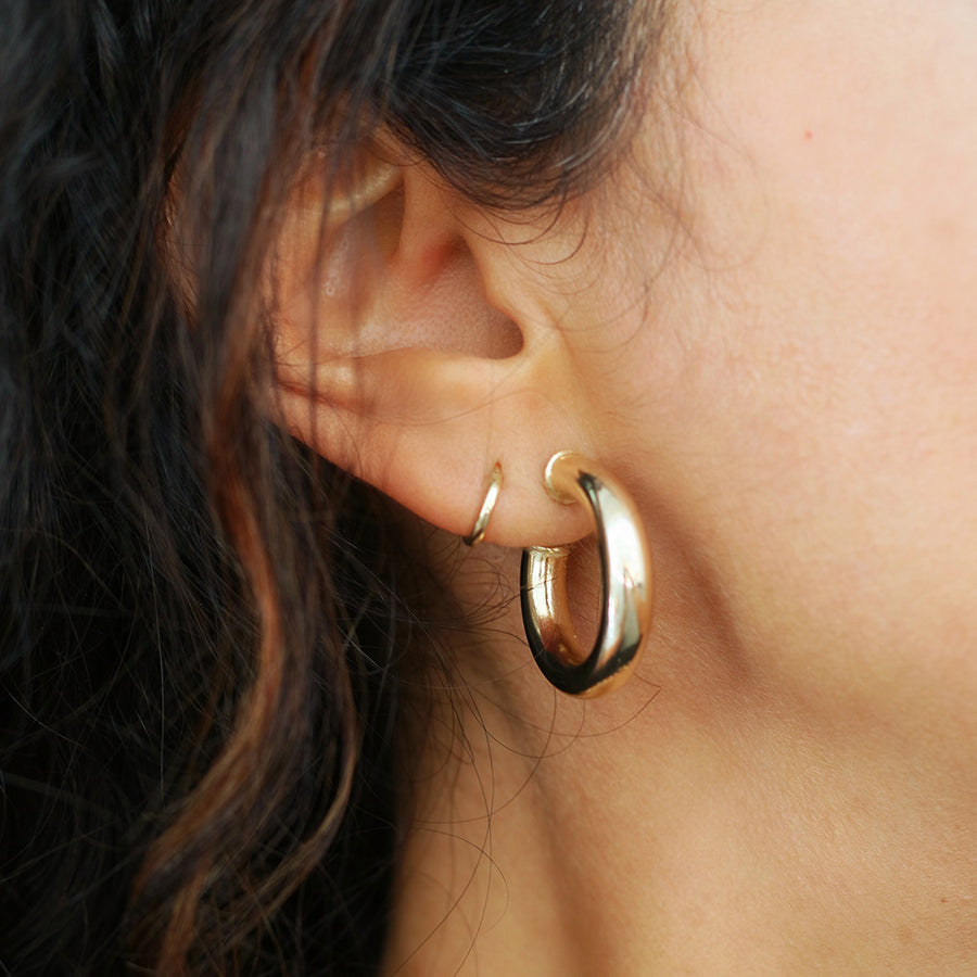 taudrey ahead of the curve open ended thick gold hoop earrings