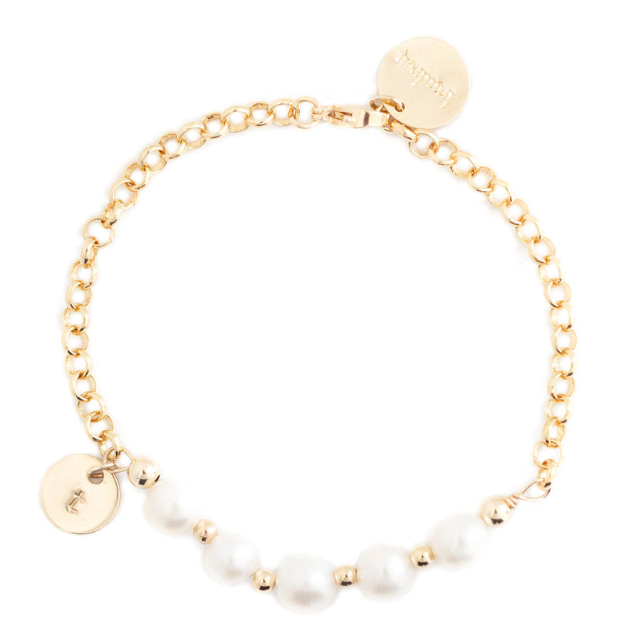 taudrey in a row pearl bracelet with multiple pearls and personalized gold charm