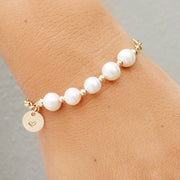 taudrey in a row pearl bracelet with multiple pearls and personalized gold charm