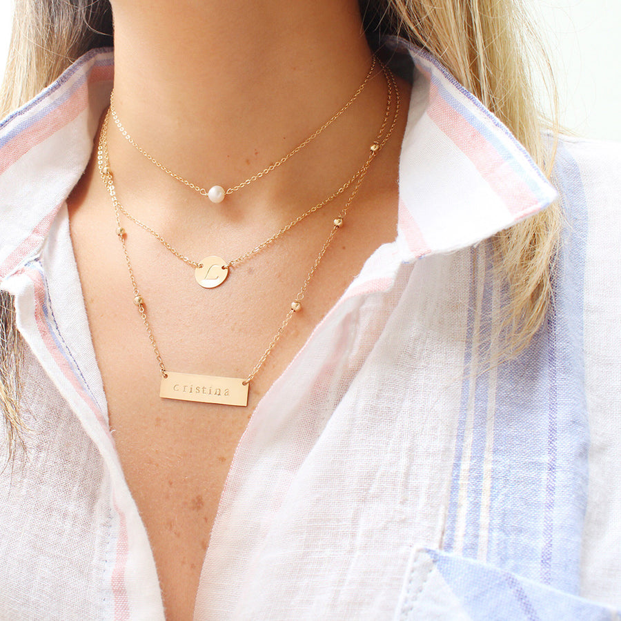 taudrey gold mini coin initial necklace gold personalized charm hand stamped with initial budget friendly layering dainty delicate gold filled 