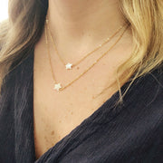 taudrey twinkle necklace dainty pearl star